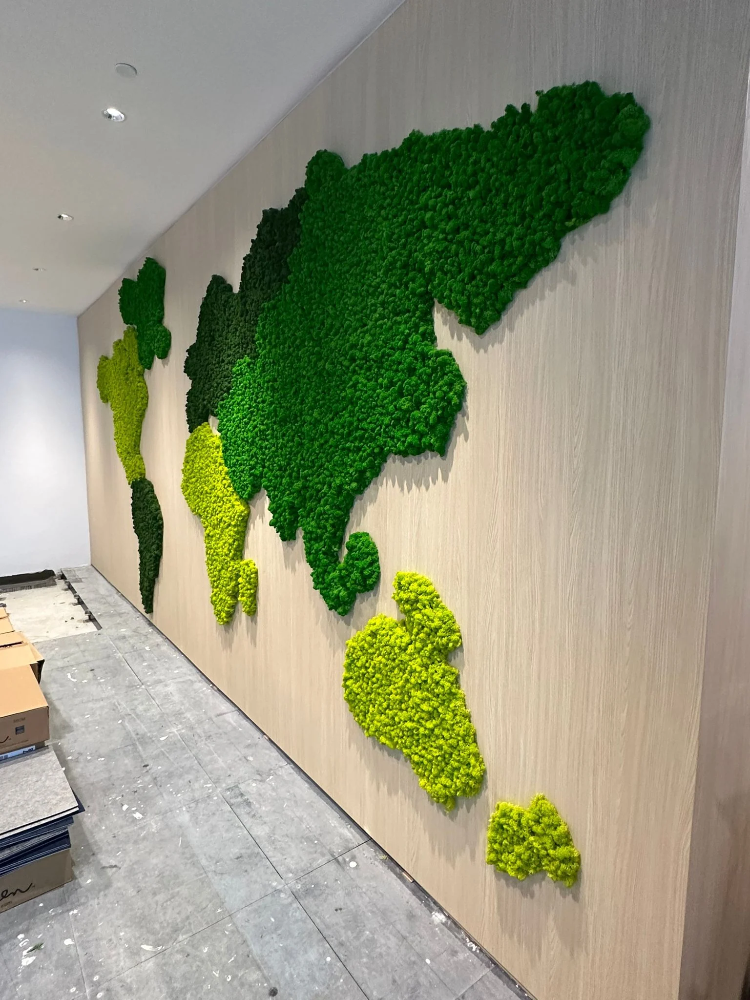 Custom moss wall installed on a timber feature wall
