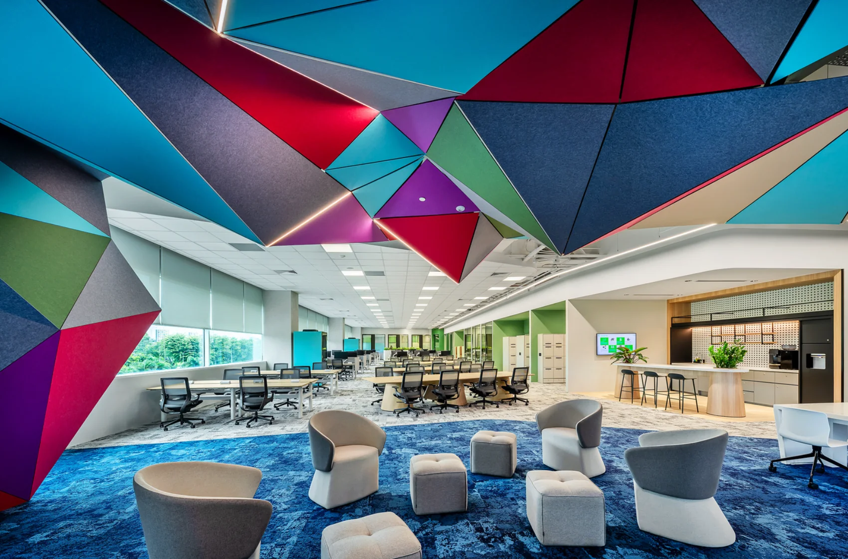 Colourful geometric sculptural acoustic ceiling feature in an open office